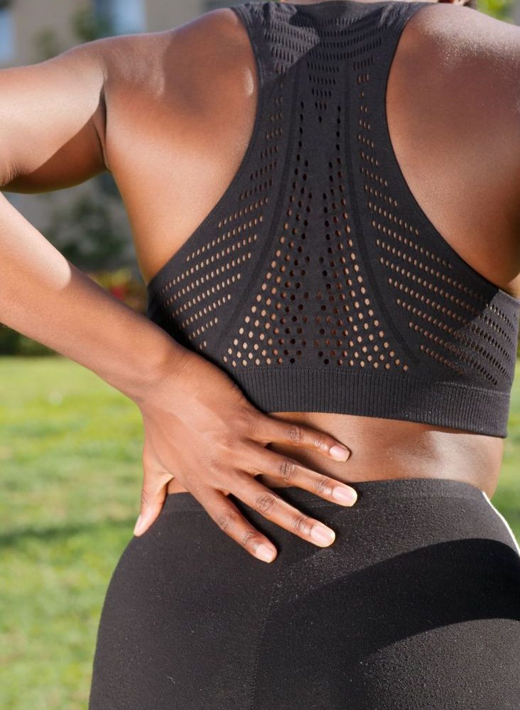 a woman having a back pain